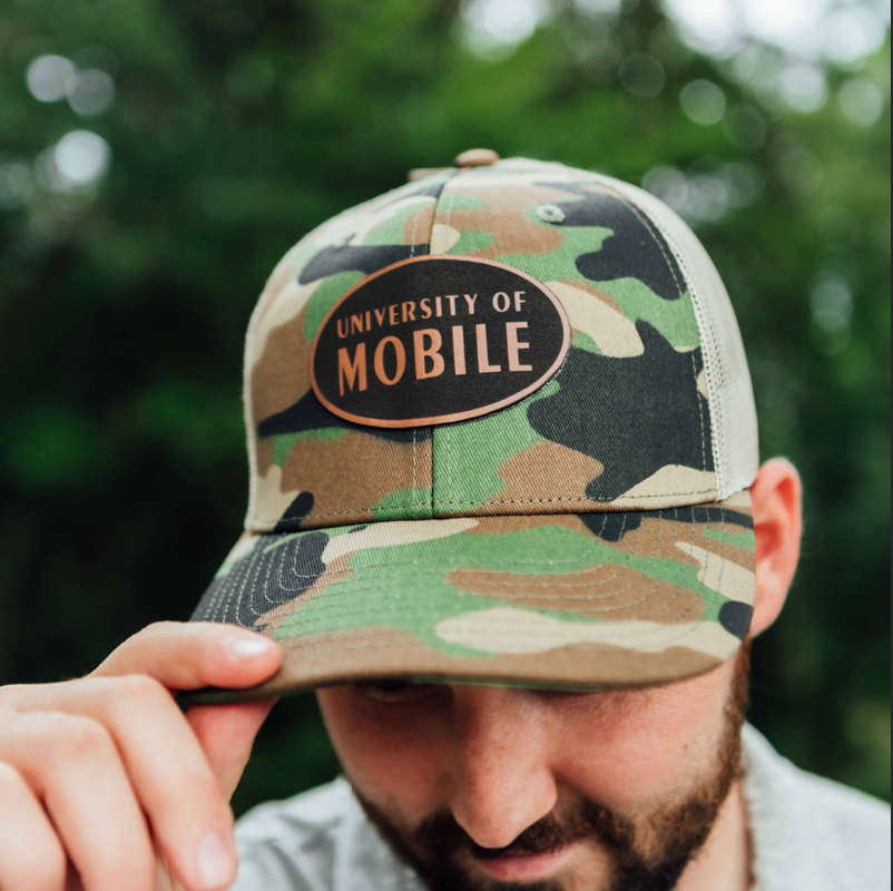 UM Woodlands Trucker Cap